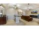 Cozy living room with a bar, ceiling fans, and a comfortable leather sofa at 5112 Highbury Grove Ln, Fuquay Varina, NC 27526
