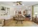 Open-concept living area showcasing hardwood floors and seamless flow to kitchen and dining spaces at 5112 Highbury Grove Ln, Fuquay Varina, NC 27526