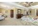 Main bedroom with trey ceilings, chandelier, sitting area, and natural lighting at 5112 Highbury Grove Ln, Fuquay Varina, NC 27526