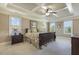 Spacious main bedroom with trey ceilings, a ceiling fan, and plenty of natural light at 5112 Highbury Grove Ln, Fuquay Varina, NC 27526