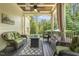 Relaxing covered porch with comfortable seating and serene views of the surrounding nature at 5112 Highbury Grove Ln, Fuquay Varina, NC 27526