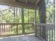 A rustic balcony surrounded by trees, enhancing the outdoor living experience at 514 Pine Ridge Pl, Raleigh, NC 27609
