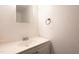 Bright bathroom with a single vanity, a decorative mirror, and modern faucet at 514 Pine Ridge Pl, Raleigh, NC 27609