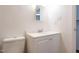 Clean and modern bathroom with a toilet, vanity and mirror, and convenient electric outlets at 514 Pine Ridge Pl, Raleigh, NC 27609