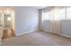 Neutral bedroom with views into the hallway and a window with plenty of natural light at 514 Pine Ridge Pl, Raleigh, NC 27609