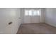 Cozy bedroom featuring soft carpeting and large windows that offer plenty of natural light at 514 Pine Ridge Pl, Raleigh, NC 27609