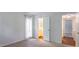 Neutral bedroom with attached bathroom, carpeted floor, and plenty of natural light at 514 Pine Ridge Pl, Raleigh, NC 27609
