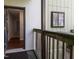 Exterior entry featuring a rustic wood porch and front door open to the home's interior at 514 Pine Ridge Pl, Raleigh, NC 27609