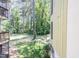 View of building exterior showing an outdoor common area with lush greenery at 514 Pine Ridge Pl, Raleigh, NC 27609