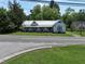 Charming vintage home featuring a covered front porch and quaint architectural details at 522 Providence Rd, Roxboro, NC 27573