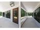 Inviting front porch with white railings and black framed windows and exterior door at 5491 Silk Hope Gum Springs Rd, Siler City, NC 27344