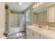 Full bathroom featuring shower and tub combination, vanity with sink, and window with natural light at 578 Jeffries Cross Rd, Burlington, NC 27217