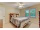 Bright bedroom features neutral walls, plush carpet, ceiling fan, and a window with natural light at 578 Jeffries Cross Rd, Burlington, NC 27217