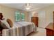 Inviting bedroom with plush carpet, ceiling fan, dresser, natural light and a warm and inviting atmosphere at 578 Jeffries Cross Rd, Burlington, NC 27217