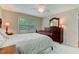 Inviting bedroom with a ceiling fan, a dresser and an ample amount of natural light from the window at 578 Jeffries Cross Rd, Burlington, NC 27217
