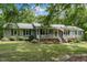 Charming single-story home featuring a welcoming front porch and well-maintained landscaping at 578 Jeffries Cross Rd, Burlington, NC 27217
