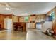 Functional kitchenette with a refrigerator, a range, and bar stool seating, perfect for casual dining at 578 Jeffries Cross Rd, Burlington, NC 27217