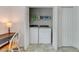 Bright laundry area with washer, dryer, shelving, and desk creating a functional and efficient space at 578 Jeffries Cross Rd, Burlington, NC 27217