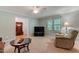 Open-concept living room with ample natural light and neutral decor at 578 Jeffries Cross Rd, Burlington, NC 27217
