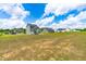 Expansive backyard view showcasing homes in a new community with a clear sky backdrop at 60 Waterwheel Dr, Selma, NC 27576