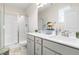 Bright bathroom with dual sinks, updated fixtures, and a glass-enclosed shower at 60 Waterwheel Dr, Selma, NC 27576