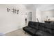 Cozy bonus room with a futon, carpeted floors, and attic access for extra storage at 60 Waterwheel Dr, Selma, NC 27576