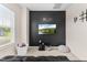 Fun bonus room with modern wall decor, carpeted floors, and a flat-screen television at 60 Waterwheel Dr, Selma, NC 27576