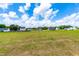 Community featuring new construction homes, expansive backyard, and clear blue skies at 60 Waterwheel Dr, Selma, NC 27576