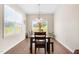 Inviting dining room features hardwood floors and a bright window for natural light at 60 Waterwheel Dr, Selma, NC 27576