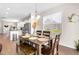 Bright dining room with hardwood floors next to the kitchen, great for modern living at 60 Waterwheel Dr, Selma, NC 27576
