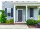 Charming front porch with a welcoming sign and seating, perfect for relaxing and enjoying the outdoors at 60 Waterwheel Dr, Selma, NC 27576