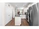 Modern kitchen with granite countertops, stainless steel appliances, and hardwood floors offers style and functionality at 60 Waterwheel Dr, Selma, NC 27576