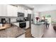 Modern kitchen with granite countertops, stainless steel appliances, and ample cabinet space at 60 Waterwheel Dr, Selma, NC 27576