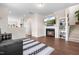 Cozy living room with a fireplace, built-in shelving, and comfortable seating for relaxation and entertainment at 60 Waterwheel Dr, Selma, NC 27576