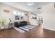 Inviting living space with wood floors, contemporary furnishings, and a view of the dining area at 60 Waterwheel Dr, Selma, NC 27576