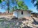 Exterior view of home surrounded by a fenced backyard and mature trees at 600 Cecil St, Durham, NC 27707