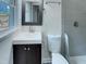 Bathroom featuring new vanity and tiled shower at 600 Cecil St, Durham, NC 27707