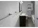 Bathroom featuring a modern vanity, framed mirror, and tiled floor at 600 Cecil St, Durham, NC 27707