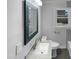 Bathroom featuring a modern vanity, framed mirror, and tiled floor at 600 Cecil St, Durham, NC 27707