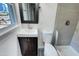 Updated bathroom with a modern vanity, stylish fixtures, and a shower-tub combo at 600 Cecil St, Durham, NC 27707