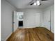Clean bedroom featuring natural light, hardwood floors and a closet at 600 Cecil St, Durham, NC 27707