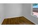 Empty bedroom featuring hardwood floors and a bright window view at 600 Cecil St, Durham, NC 27707