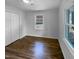 Bedroom with gleaming hardwood floors, natural light, and spacious layout, perfect for a relaxing retreat at 600 Cecil St, Durham, NC 27707