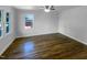 Bright bedroom with hardwood floors, fresh paint and a large window at 600 Cecil St, Durham, NC 27707