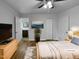 Serene bedroom featuring a cozy bed, wood floors, and modern decor, all bathed in gentle, natural light at 600 Cecil St, Durham, NC 27707