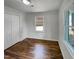 Bright bedroom with hardwood floors, white trim and a spacious closet at 600 Cecil St, Durham, NC 27707