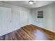 Cozy bedroom with a double door closet and hardwood floors at 600 Cecil St, Durham, NC 27707