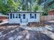 Charming single-story home with a freshly painted exterior and manicured front yard at 600 Cecil St, Durham, NC 27707