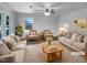 Bright living room featuring plush sofas, stylish chairs, and a cozy, decorative rug, all bathed in natural light at 600 Cecil St, Durham, NC 27707