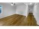 View of living room featuring gleaming wood floors, natural light, and a spacious layout, perfect for entertaining at 600 Cecil St, Durham, NC 27707
